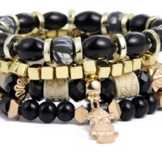 Kuldsete ja mustade käevõrude komplekt